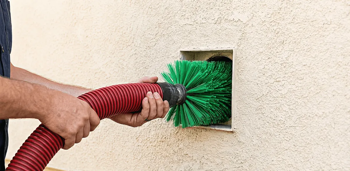 Air duct cleaning brush removing debris from a vent opening in Charlotte, NC