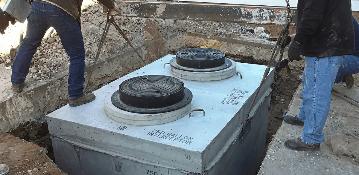 Grease trap installation for a commercial property drainage system in Charlotte, NC