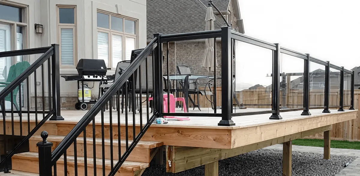 Handrail installation on a deck staircase for safety and code compliance in Charlotte, NC
